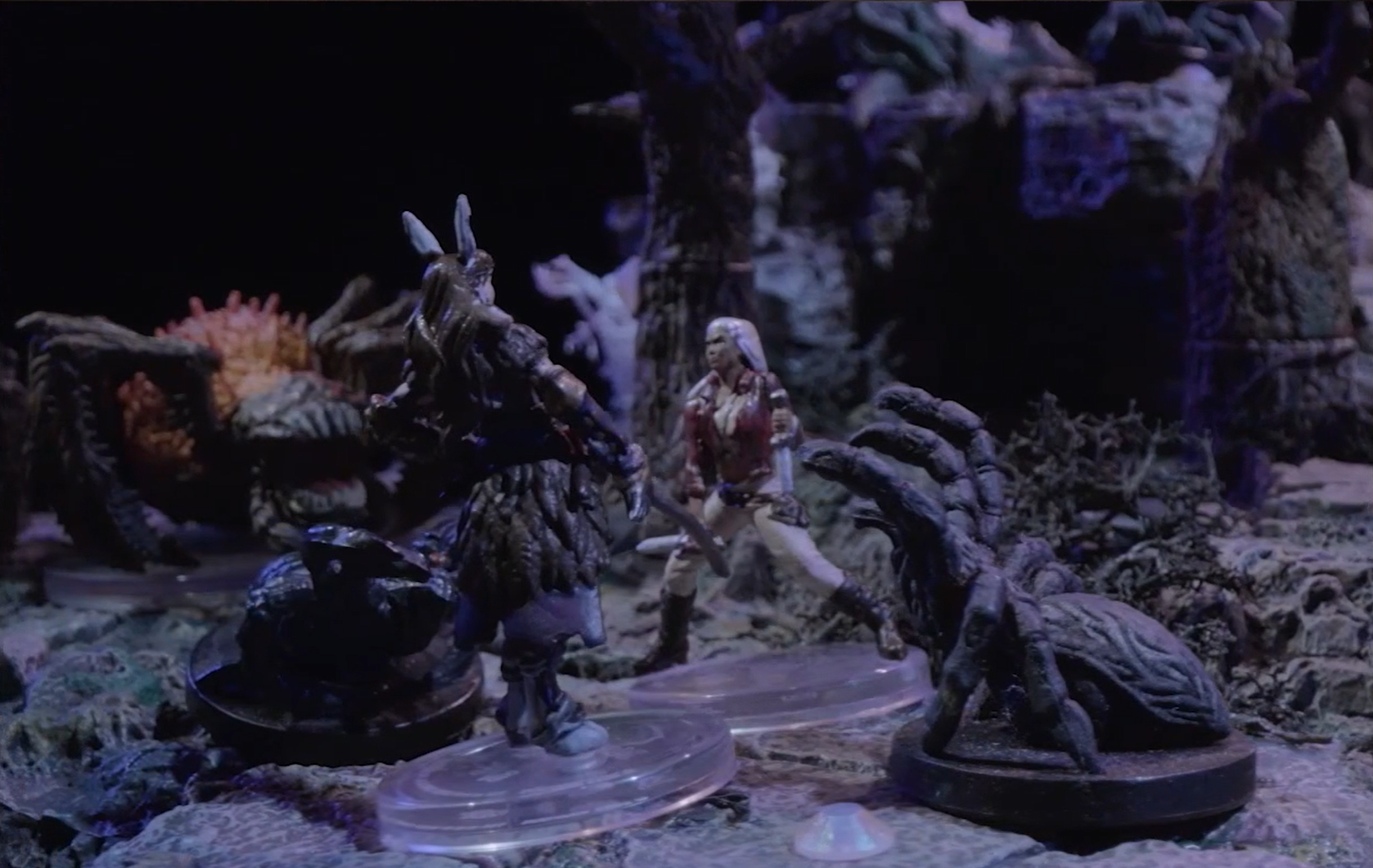 A battlemap where Opal stands with Morrighan in front of her, a giant spider to her side, and a massive spider-like creature with a furry orange abdomen in the background.