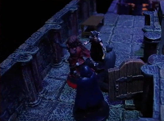 A battlemap of a stone hallway outside an open door. Thaisha faces off against three robed individuals, one of which is Ethrand Tachonis. Ethrand wears silver armor on his wrists, shoulders, and head. Down the hallway, stairs leading down are visible.