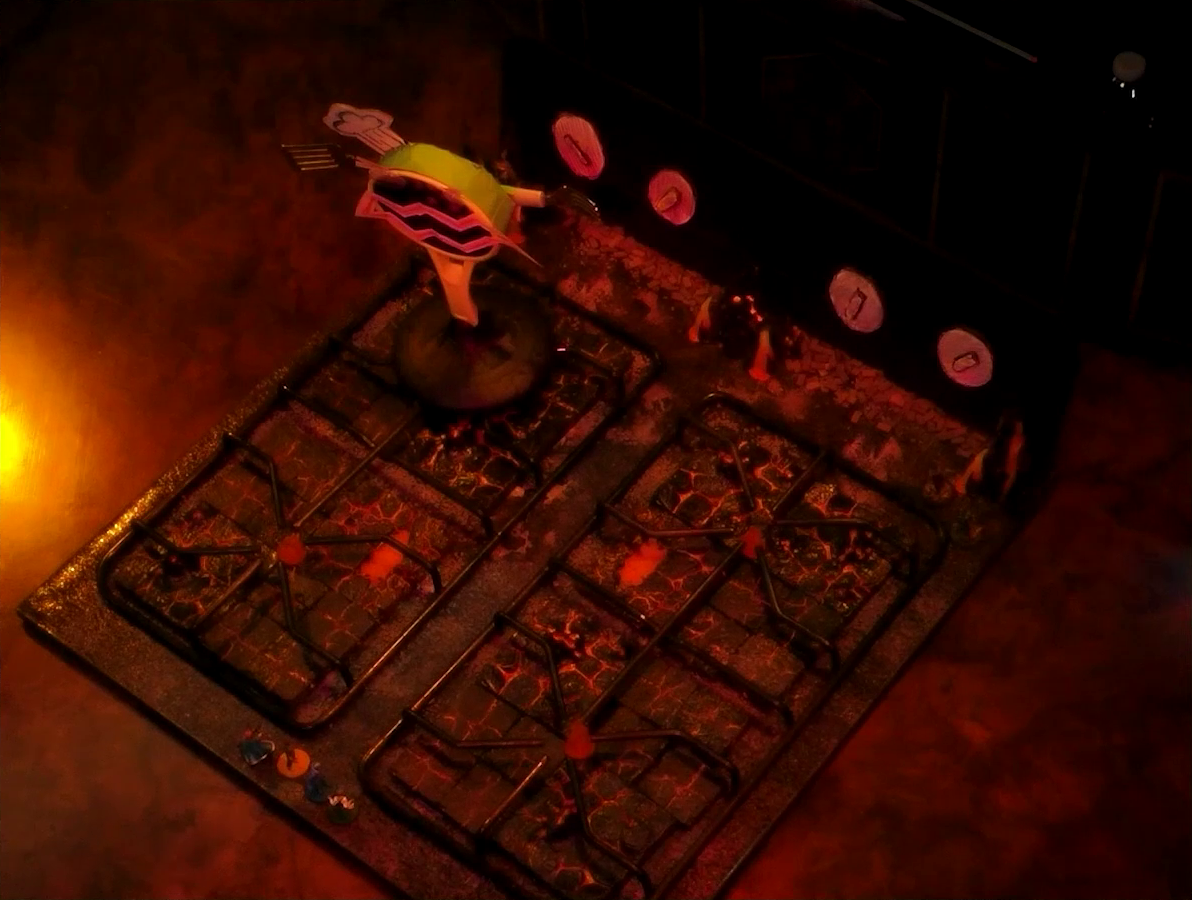 A battlemap that looks like a stovetop. Small flames sprout from each of the four burners and four knobs are on the back panel. Wok Wok, the giant frying pan creature, is on the back left burner. It stands up on its handle. Its mouth, eyebrows, and chef’s hat are made from cut-up paper. It has two googly eyes and several more in the darkness behind its mouth. Its right arm is a spatula and its left arm is a fork. Sky, Kai, Jessep, and Padmund stand at the front of the battlemap and Yasha and Beau stand at the back. The base of the battlemap looks like magma and the scene is bathed in red light.