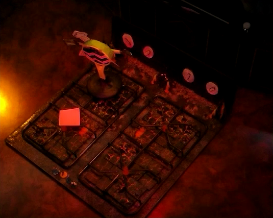 A battlemap that looks like a stovetop. Small flames sprout from each of the four burners and four knobs are on the back panel. A pink sticky note is on the front left burner. Wok Wok, the giant frying pan creature, is on the back left burner. Sky, Kai, Jessep, and Padmund stand at the front of the battlemap and Yasha and Beau stand at the back. The base of the battlemap looks like magma and the scene is bathed in red light.