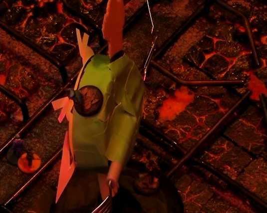 A close-up of a battlemap that looks like a stovetop. The camera is focusing on the back of Wok Wok, the giant frying pan creature. Beau stands on its head and Yasha stands on its base. On the ground below are Jessep and Kai. The base of the battlemap looks like magma and the scene is bathed in red light.