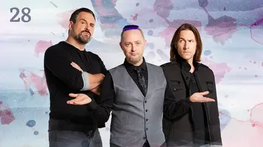 Thumbnail for episode 28. Travis, Taliesin, and Matt pose side-by-side. Travis’s looks serious with his arms crossed. Taliesin’s palms are up in a shrug. Matt looks nervously at Travis. They are dressed in black and gray and stand against a colorful backdrop with splashes of reds and blues over white.