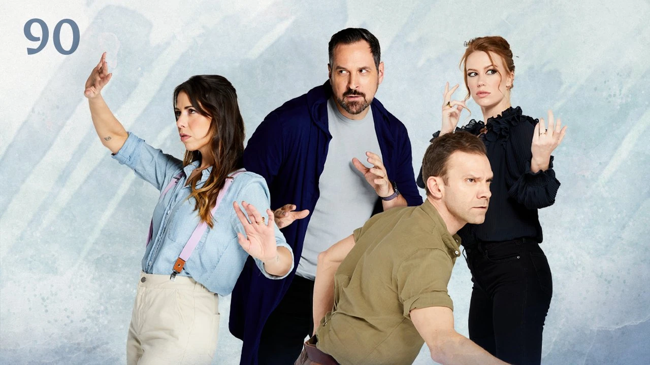 Thumbnail for episode 90. Laura, Travis, Liam, and Marisha stand in action poses looking in every direction. Laura and Marisha have their hands raised to cast spells while Travis and Liam take physical combat stances, Liam crouching low. Laura wears a sky blue shirt and pink suspenders, Travis and Marisha wear dark blue and black, and Liam wears a green tucked-in polo. They stand against a colorful backdrop with streaks of pale blue over white.