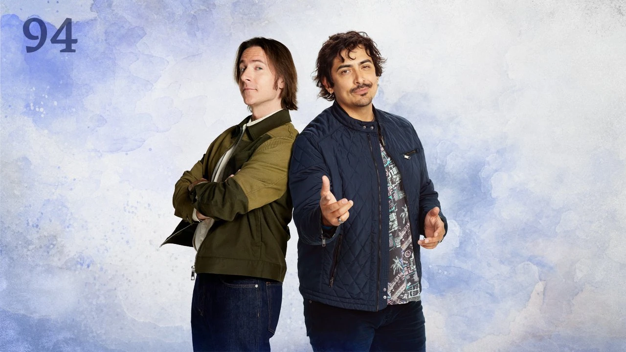 Thumbnail for episode 94. Matt and Robbie Daymond pose coolly back-to-back. Matt’s arms are crossed and Robbie reaches out gregariously, a subtle smile on his face. Matt wears a brown leather jacket and Robbie wears a puffy blue vest. They stand against a colorful backdrop with splashes of blues over white.