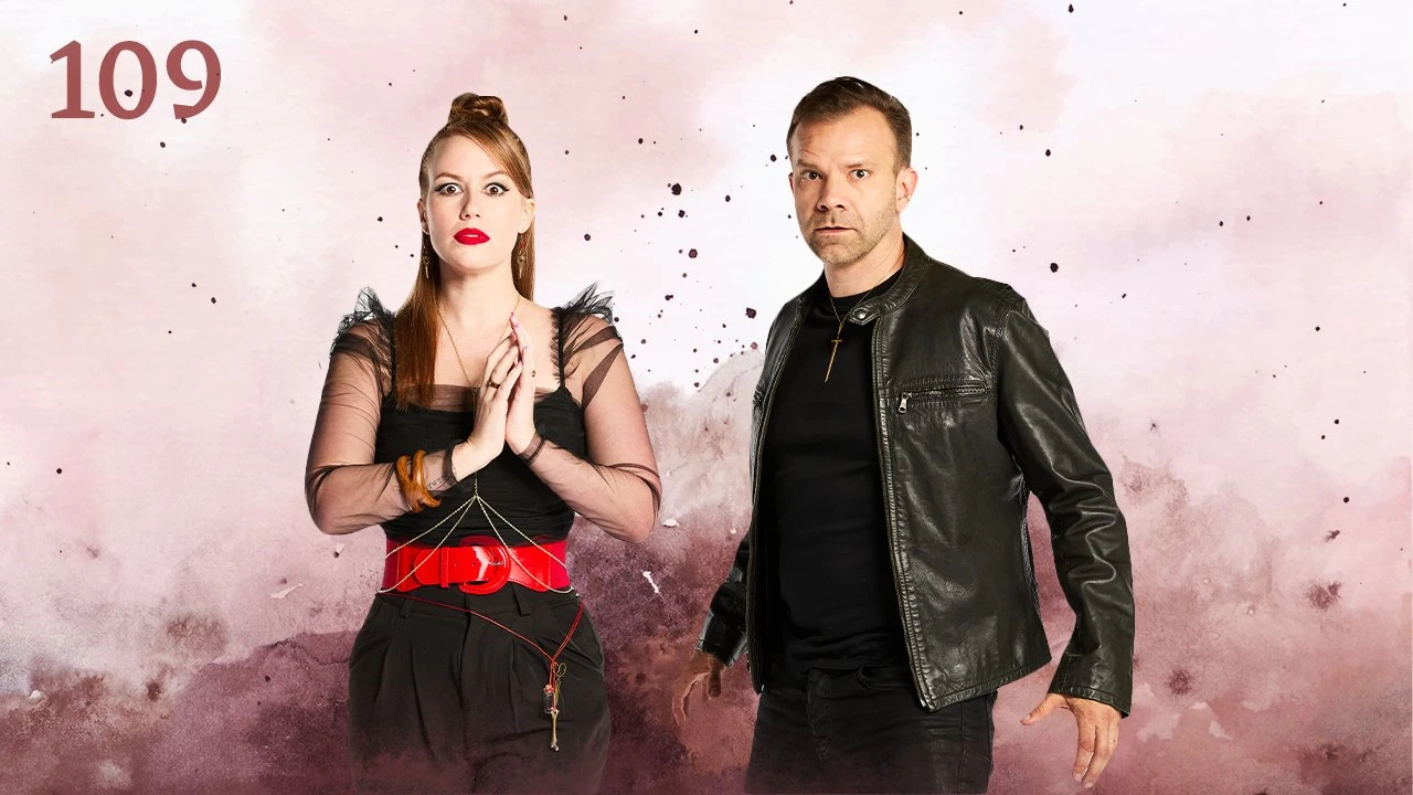 Thumbnail for episode 109. Marisha and Liam pose side-by-side looking wide-eyed at the viewer. Marisha’s hands are together in front of her while Liam stands at an angle, ready to take action. Marisha wears a gauzy black dress with red belt and scissors on a red string around her waist. Liam wears a leather jacket, black shirt, and sword necklace. They stand against a colorful backdrop with splashes and specks of maroon over white.