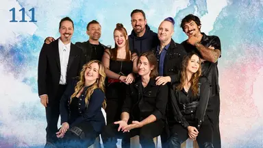 Thumbnail for episode 111. A group photo of Sam, Liam, Marisha, Travis, Taliesin, Robbie Daymond, Ashley, Matt, and Laura. They are posed with their arms on each other’s shoulders, smiling widely. They are dressed in mostly black and blue with a white shirt on Sam and some red accents on Marisha. They stand against a colorful backdrop with splashes of blues, greens, reds, and oranges over white.