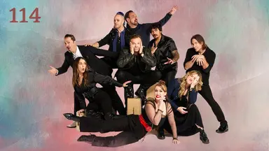 Thumbnail for episode 114. A group photo of Sam, Taliesin, Travis, Robbie Daymond, Matt, Laura, Liam, Marisha, and Ashley. They make a variety of goofy poses, including Marisha laying sideways in front of the group, Robbie in combat stance with one eyebrow raised, Ashley with her face smushed against her hand, Liam perched on a box labeled “matt”, and Matt leaning forward spookily with his hands resting on an invisible cane. They are dressed in mostly black and blue with a white shirt on Sam and some red accents on Marisha. They are placed against a colorful backdrop with splashes of reds, greens, and blues over white.