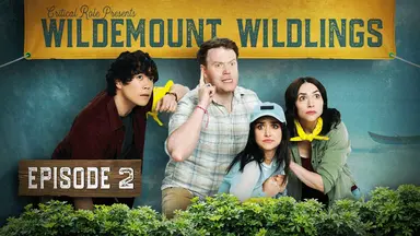 Thumbnail for episode 2. Aleks Le, Brennan Lee Mulligan, Libe Barer, and Eden Riegel stand nervously side-by-side, looking into the distance. All are dressed in outdoorsy camp clothes and sport yellow bandanas. Text at the top of the image on a large fabric banner reads “Critical Role Presents Wildemount Wildlings” and bushes line the bottom of the image. Aleks has his arm on Brennan’s shoulder, Brennan has one finger up in an expression of extreme goofy concentration, and Libe and Eden crowd together frightened.